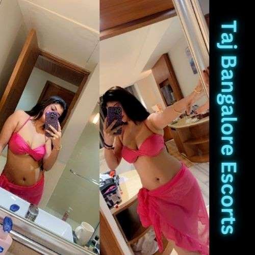 Elite Btm escort models posing near a luxury sports car Showroom in Bangalore